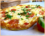 Frittata con pomodori e formaggio blu di capra